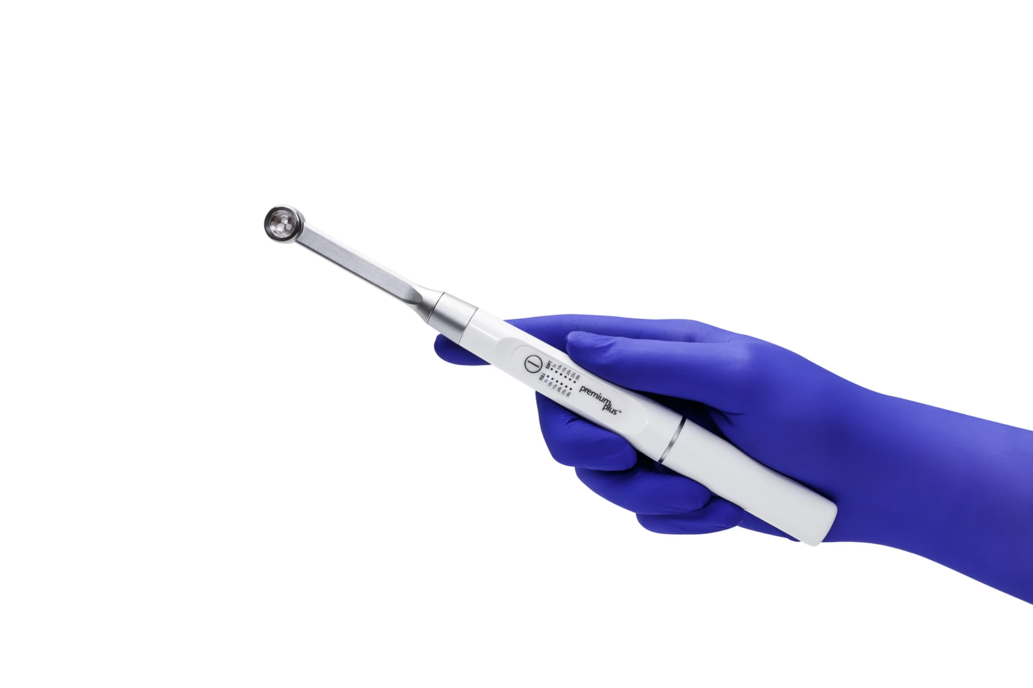 Hand hält Premium Plus C02M Polymerisationslampe für zahnärztliche Anwendungen